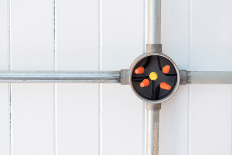 Conduit junction box connects multiple wires in a communal meeting spot.